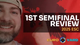 ESC 2025 First Semifinal Recap - smiling in front of Albanian flag